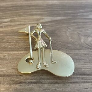 Vintage gold tone lady golfer brooch